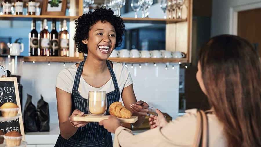 customer interacting with staff in a retail setting